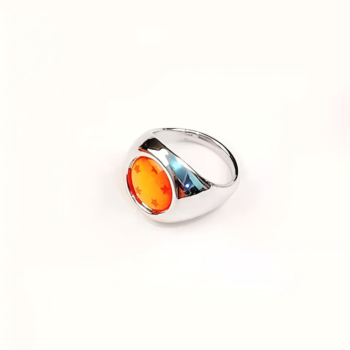 Une bague en métal argenté avec une pierre orange sertie au centre. La pierre est ornée de sept étoiles rouges.,BA-5561383957,BA-7617355432,BA-0283057920,BA-7754421011,BA-4666403701,BA-4371318363,BA-9089187898