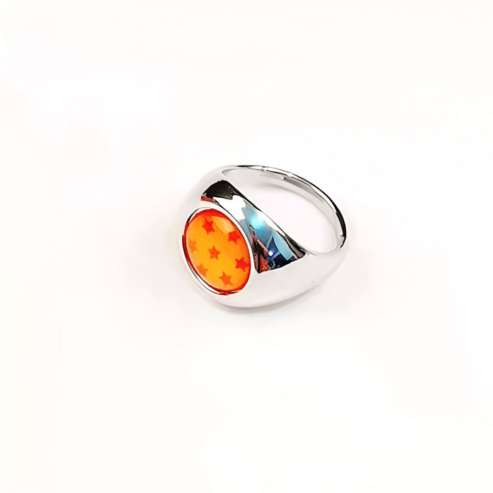 Une bague en métal argenté avec une pierre orange sertie au centre. La pierre est ornée de sept étoiles rouges.,BA-5561383957,BA-7617355432,BA-0283057920,BA-7754421011,BA-4666403701,BA-4371318363,BA-9089187898