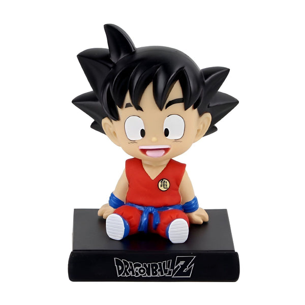 Une figurine de Son Goku, un personnage de Dragon Ball Z. Il est assis sur un socle noir et porte une combinaison orange et bleue. Il a les cheveux noirs et les yeux bleus.,BO-8449687543