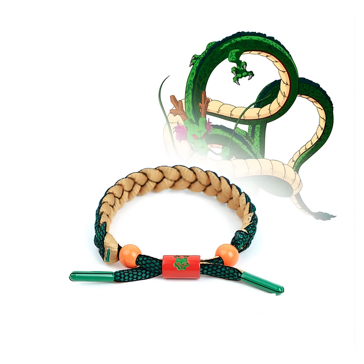 Le bracelet Shenron Dragon Ball Z est un bijou porté au poignet. Il est de couleur marron et possède des boules oranges et vertes. Le bracelet est orné d'un motif représentant le dragon Shenron.,BR-9791605424