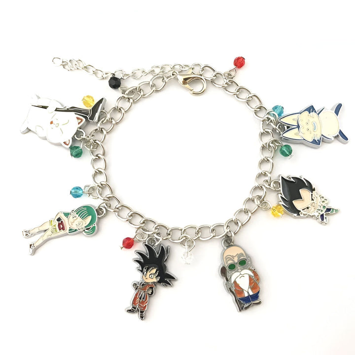 Le bracelet est composé de 7 charms en métal émaillé représentant les personnages du dessin animé Dragon Ball Z. Les charms sontGoku, Vegeta, Piccolo, Gohan, Trunks, Krilin et Bulma. Le bracelet est en acier inoxydable et mesure 20 cm de long.,BR-6636297123