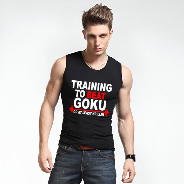 Un homme porte un débardeur noir avec l'inscription "Training to beat Goku or at least Krilin". Il a les cheveux bruns et les yeux bleus. Il est vêtu d'un jean bleu et porte une montre noire. Il est debout, les bras croisés sur la poitrine.,DS-1820074188,DS-4912136697,DS-9168130716,DS-1821577221,DS-4504184621,DS-4913117025,DS-9125523074,DS-0877768110,DS-5415492976,DS-0765171295,DS-5171594678,DS-5203321418,DS-4488968171,DS-1188415026,DS-082653774X