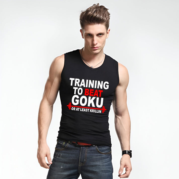 Un homme porte un débardeur noir avec l'inscription "Training to beat Goku or at least Krilin". Il a les cheveux bruns et les yeux bleus. Il est vêtu d'un jean bleu et porte une montre noire. Il est debout, les bras croisés sur la poitrine.,DS-1820074188,DS-4912136697,DS-9168130716,DS-1821577221,DS-4504184621,DS-4913117025,DS-9125523074,DS-0877768110,DS-5415492976,DS-0765171295,DS-5171594678,DS-5203321418,DS-4488968171,DS-1188415026,DS-082653774X