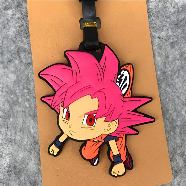 Un porte-clés en caoutchouc à l'effigie de Son Goku, un personnage de la série animée Dragon Ball Z. Il est représenté avec ses cheveux roses et sa combinaison orange.,É-7953792885