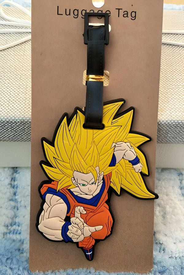 Une image d'un porte-étiquette de bagage en caoutchouc à l'effigie de Son Goku, un personnage de la série animée japonaise Dragon Ball Z.,É-8986427362