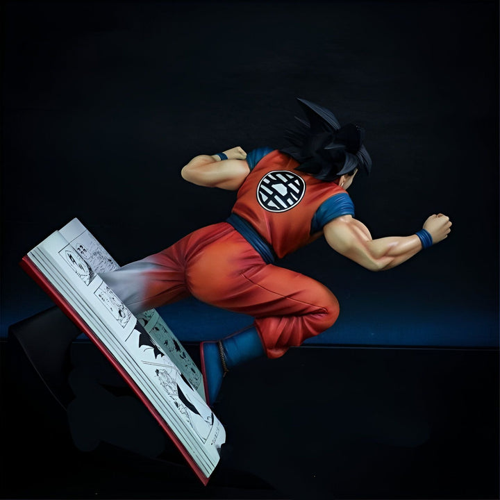 Une figurine de Son Goku, un personnage de Dragon Ball Z, en train de voler sur un livre ouvert.,FI-0959356940