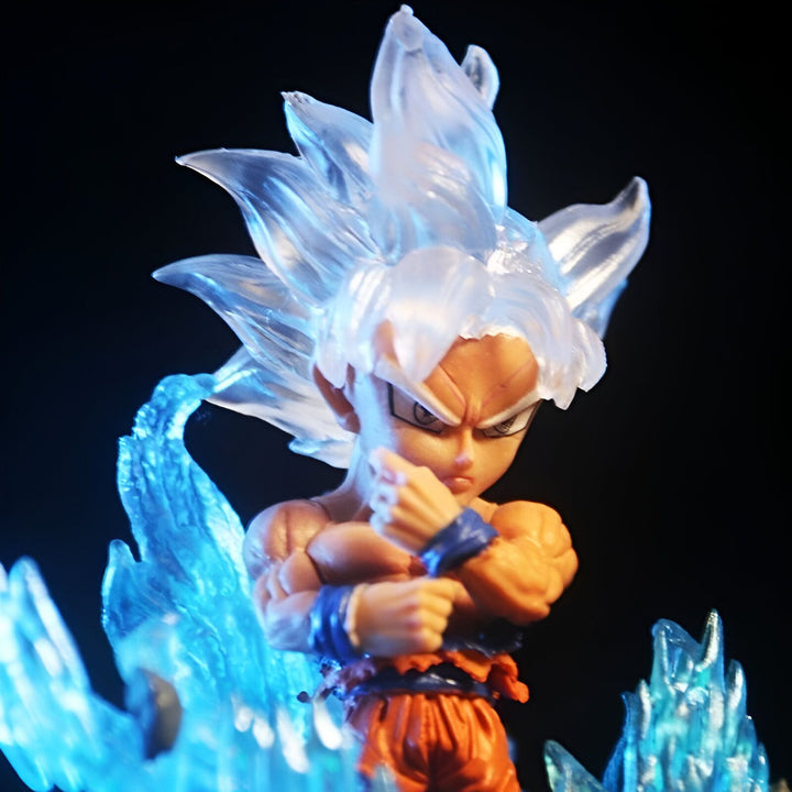Une figurine de Son Goku, un personnage de la série animée Dragon Ball Z. Il est représenté en train de se transformer en Super Saiyan Blue, une transformation qui lui donne des cheveux bleus et une aura bleue.,FI-538701792X