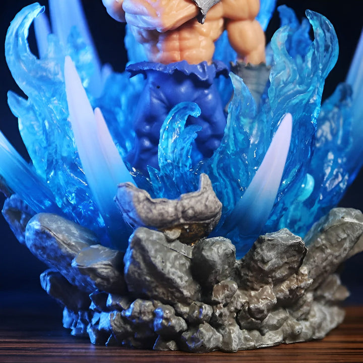 Une figurine de Son Goku, un personnage de Dragon Ball Z, est représentée sur un socle rocheux. Il est entouré d'un feu bleu transparent.,FI-632171478X