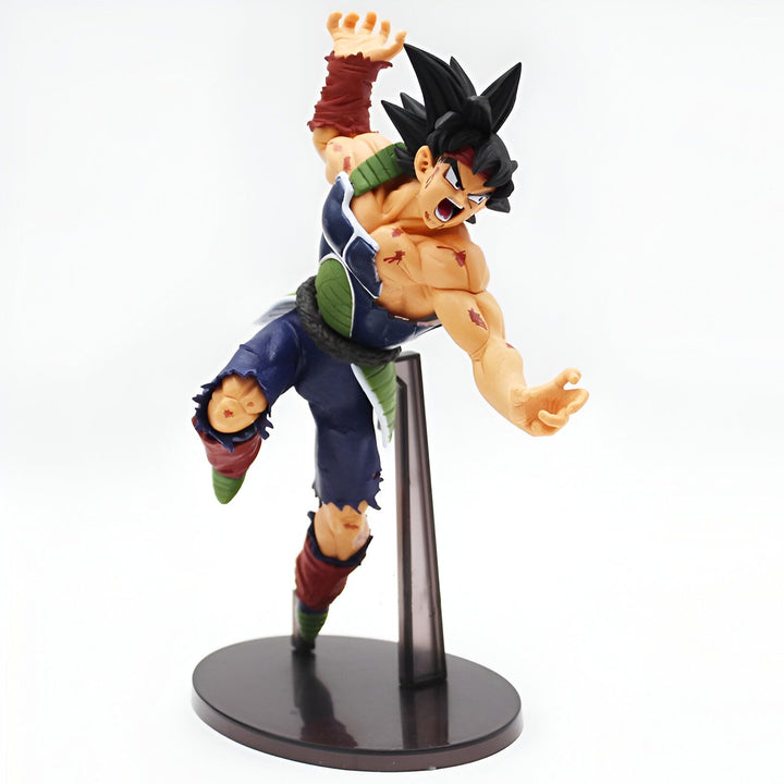Une figurine de Bardock, le père de Goku, dans sa tenue de combat Saiyan. Il a les cheveux noirs hérissés, les yeux bleus et une cicatrice sur le visage. Il est en position d'attaque, le poing droit en avant et la jambe gauche en arrière.,FI-3188719108