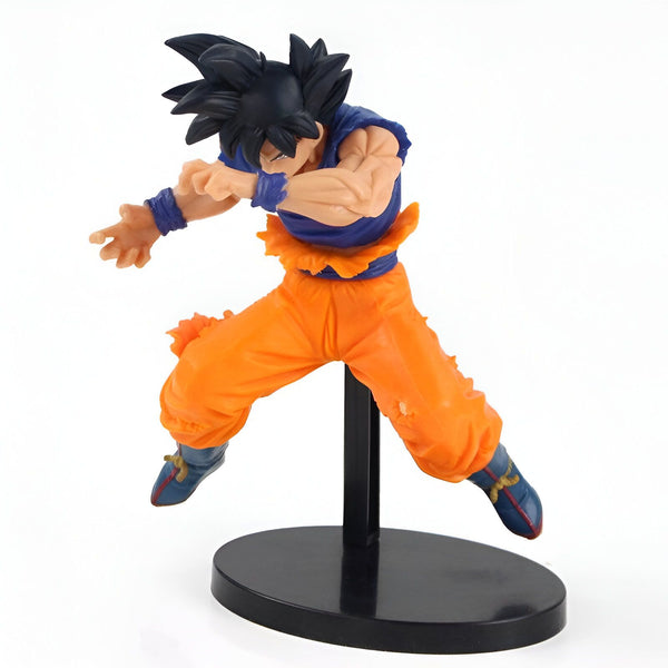 Une figurine de Son Goku, un personnage de la série animée Dragon Ball Z. Il est représenté en train de voler, avec ses cheveux noirs hérissés, sa combinaison orange et bleue déchirée, et ses poings serrés.,FI-2500331369