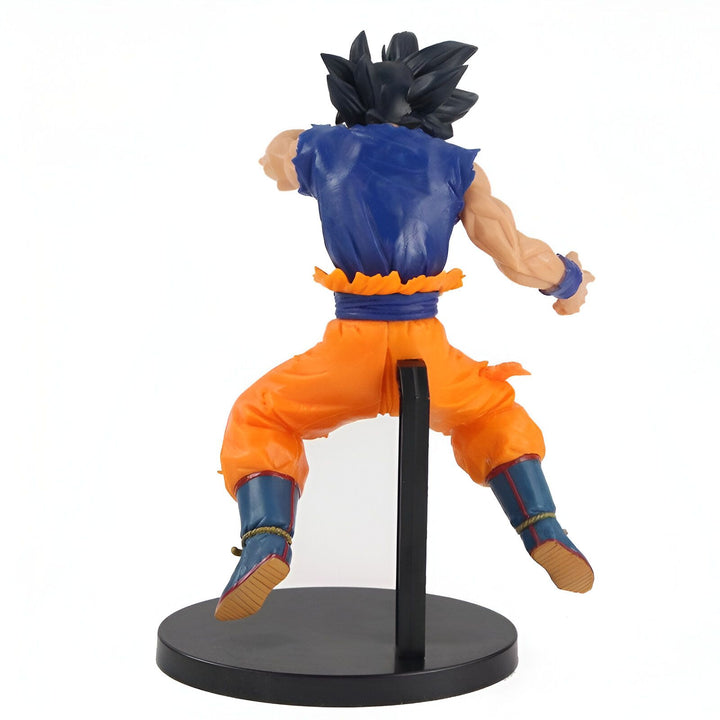 Une figurine de Son Goku, un personnage de la série animée Dragon Ball Z. Il est vêtu de son costume orange et bleu et est en position de combat.,FI-2500331369