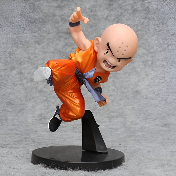 Une figurine de Krilin, un personnage de Dragon Ball Z. Il est représenté en train de faire un coup de pied sauté. Il porte un gi orange et une ceinture bleue. Il est chauve et a trois points sur le front.,FI-9230761451