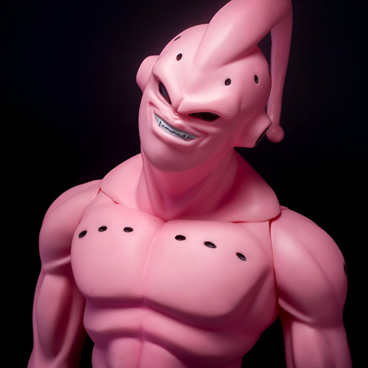 Une figurine en plastique rose de Boo, un personnage de Dragon Ball Z. Boo est un extraterrestre maléfique qui a absorbé les pouvoirs de nombreux autres personnages, ce qui lui a donné une apparence monstrueuse. Il est l'un des ennemis les plus puissants de Goku et de ses amis.,FI-6638739190