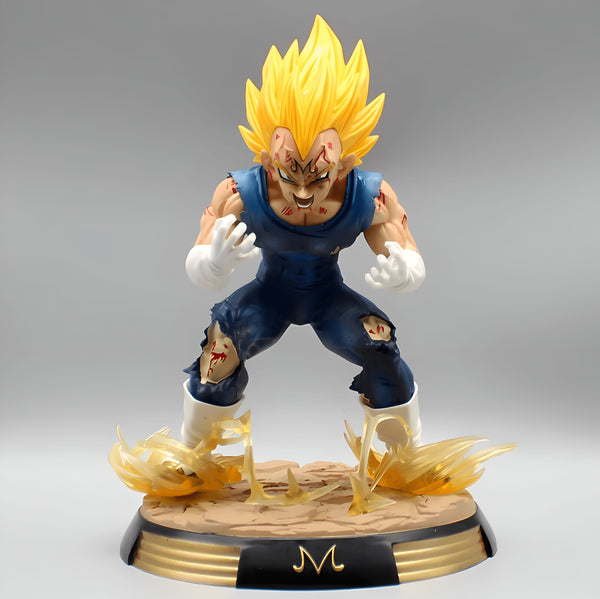 Une figurine de Vegeta, un personnage de Dragon Ball Z. Il est représenté avec les cheveux jaunes, la peau bronzée et porte une combinaison bleue déchirée. Il est en position de combat, le poing droit en avant et la paume gauche ouverte. La figurine est posée sur un socle doré avec le logo de Dragon Ball Z.,FI-3778162152