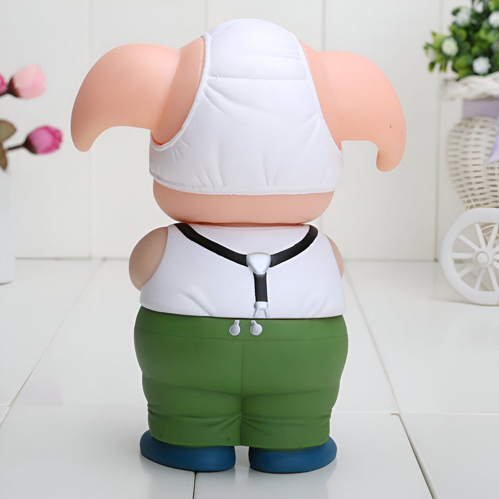 Une figurine de cochon en plastique, portant un gilet blanc et un pantalon vert.,FI-9862983256