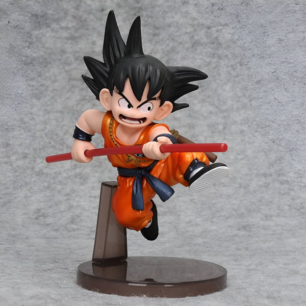 Une figurine de Son Goku, un personnage de la série animée Dragon Ball. Il est représenté en train de voler et de tenir un bâton dans ses mains. Il porte un gi orange et une ceinture bleue.,FI-3472203811