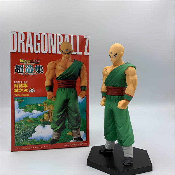 Une figurine de Tenshinhan, un personnage de Dragon Ball Z. Il est vêtu d'un pantalon vert et d'une chemise orange. Il a les cheveux blancs et les yeux bleus. Il est en position de combat.,FI-0979498996