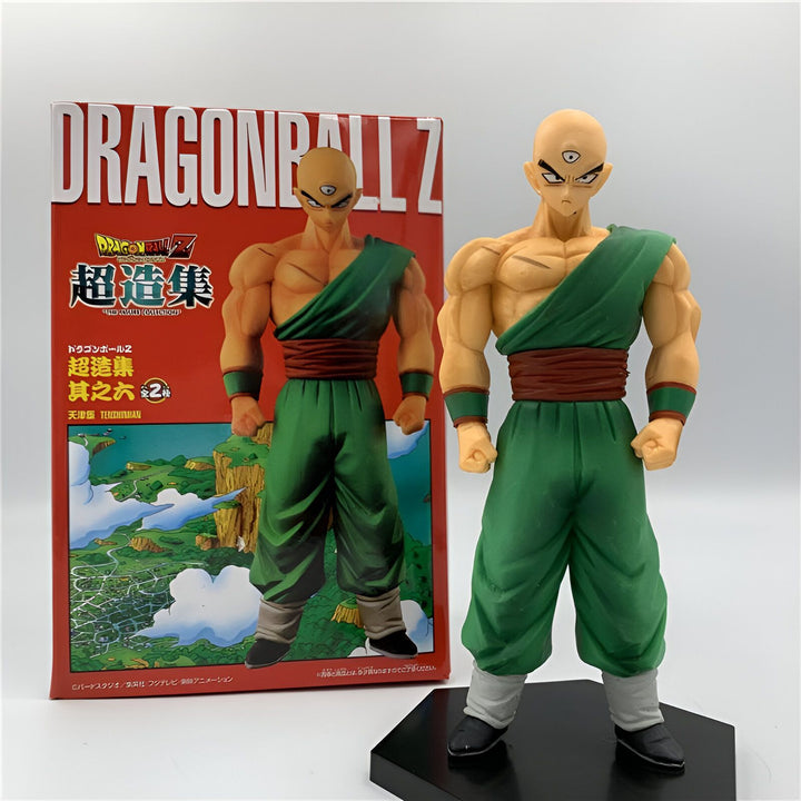 Une figurine de Tenshinhan, un personnage de Dragon Ball Z. Il est chauve et a trois yeux, et porte une tenue verte. Il est représenté en position de combat.,FI-0979498996
