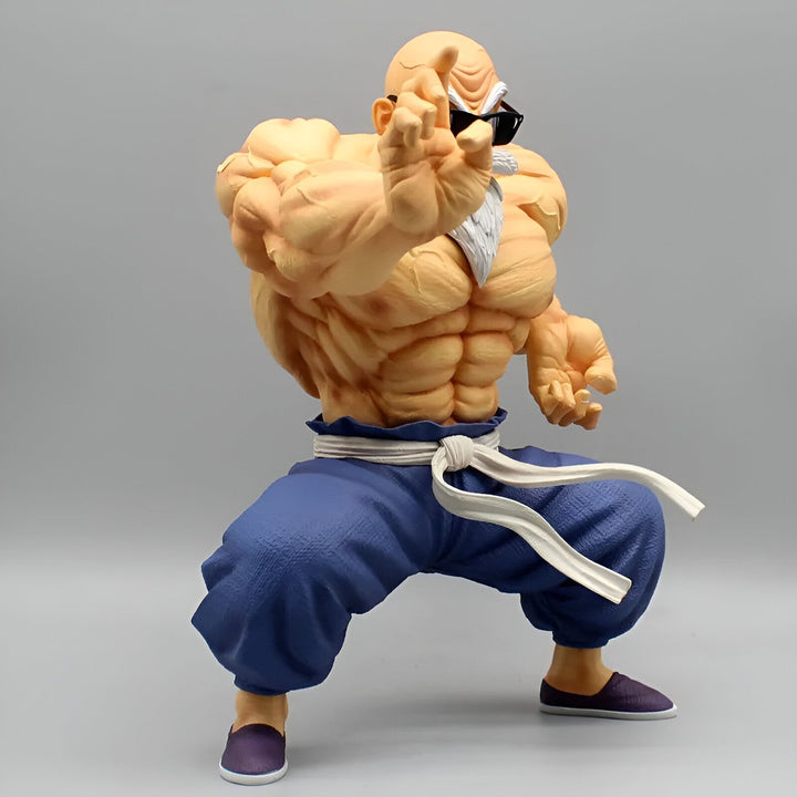 Une figurine en plastique du personnage Master Roshi de la série Dragon Ball Z. Il est représenté avec ses lunettes de soleil, sa ceinture blanche et son pantalon bleu. Il est en position de combat, le poing droit en avant et la paume gauche ouverte.,FI-2942176539