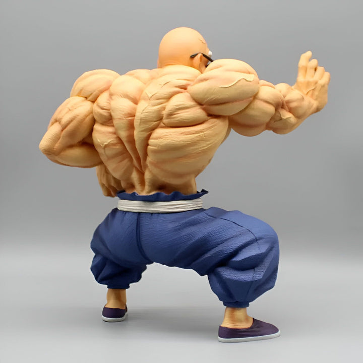 L'image montre un personnage chauve et musclé de dos. Il porte un pantalon bleu et une ceinture blanche. Il est en position de combat.,FI-2942176539