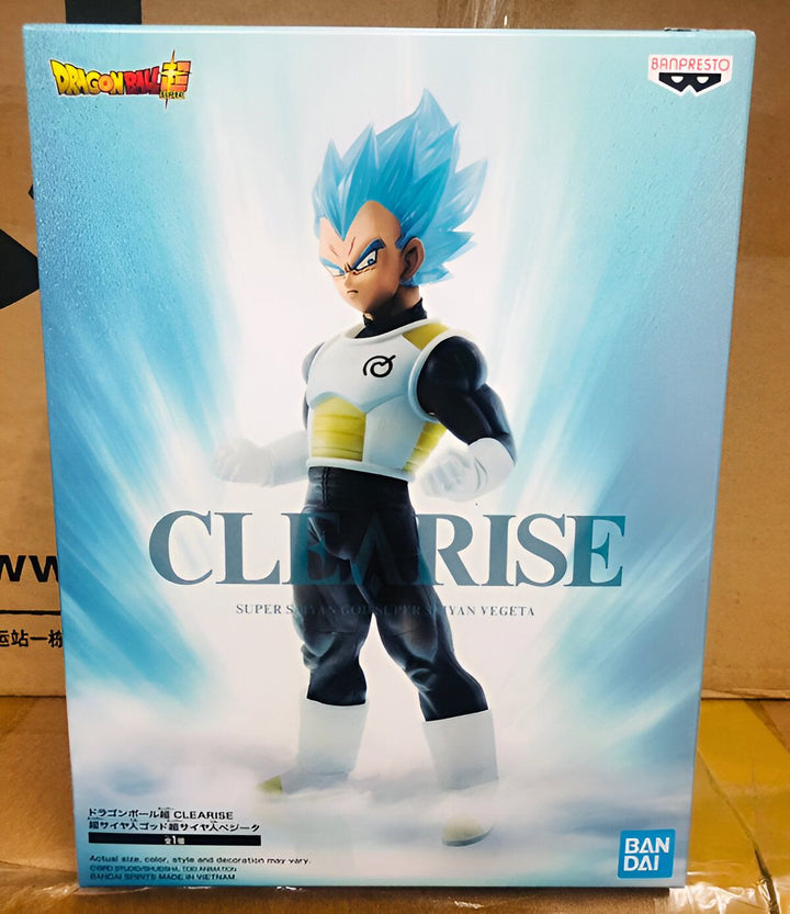 Une figurine de Vegeta, un personnage de Dragon Ball Super, dans sa tenue de combat bleue et blanche. Il est debout, les poings serrés, prêt à se battre. La figurine est dans une boîte transparente avec un socle noir.,FI-8742162742