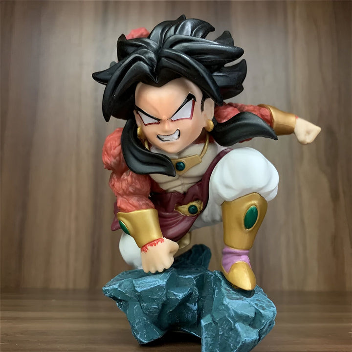 Une figurine de Broly, un personnage de Dragon Ball Z, en position de combat, avec ses cheveux noirs hérissés, sa peau verte et ses muscles saillants. Il porte une armure dorée et rouge et des bottes blanches. Il est accroupi sur un rocher, prêt à bondir sur son adversaire.,FI-6319481943