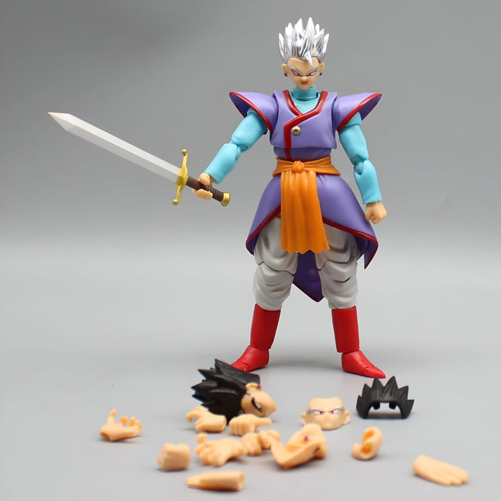 Une figurine de collection de Son Gohan, un personnage de la série Dragon Ball Z. Il est vêtu d'une tenue traditionnelle japonaise et tient une épée dans sa main droite. Il y a des pièces détachées de figurines autour de lui.,FI-6520634034