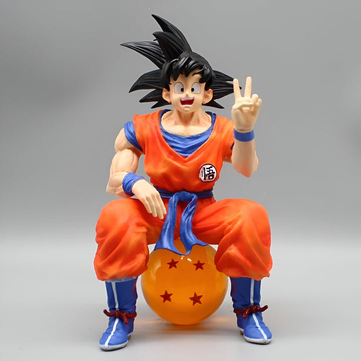 Une figurine de Son Goku, un personnage de la série animée Dragon Ball Z. Il est assis sur une boule de cristal et fait un signe de la main.,FI-7303422293