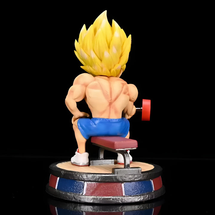 Une figurine de Son Goku, un personnage de Dragon Ball Z, est assis sur un banc et soulève des poids. Il est vêtu d'un short bleu et de chaussures blanches.,FI-9124101168