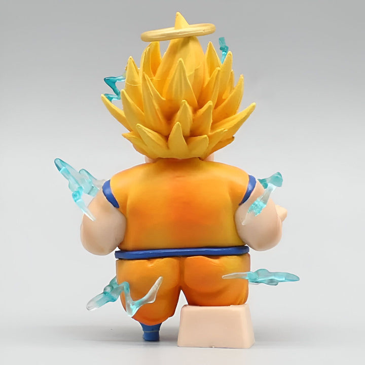 Une figurine de Son Goku, un personnage de la série animée Dragon Ball Z. Il est représenté avec les cheveux jaunes et les yeux bleus, et porte une combinaison orange et bleue. Il est en position de combat, avec les poings serrés et les jambes écartées.,FI-6459962774
