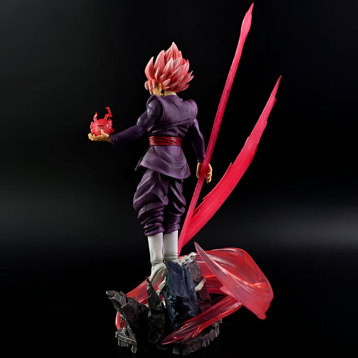 Une figurine de collection de Son Goku, un personnage de la série animée Dragon Ball Super. Il est représenté avec ses cheveux roses et sa tenue vestimentaire noire et violette. Il est en train de charger une attaque énergétique rouge dans sa main droite.,FI-4899512767