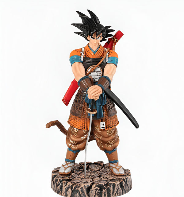 Une figurine de Son Goku, un personnage de la série animée Dragon Ball Z. Il est vêtu d'un kimono orange et blanc et porte une épée.,FI-0769927459