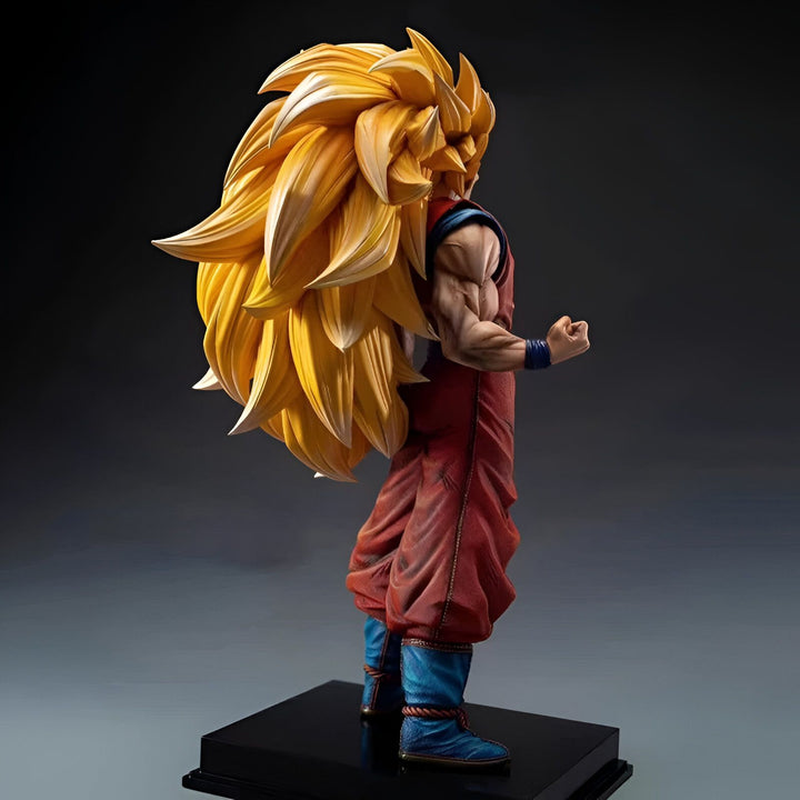 Une figurine de Son Goku, un personnage de la série animée Dragon Ball Z. Il est représenté avec ses cheveux longs et blonds, vêtu de son costume orange et bleu. Il est en position de combat, le poing droit levé.,FI-8547694439