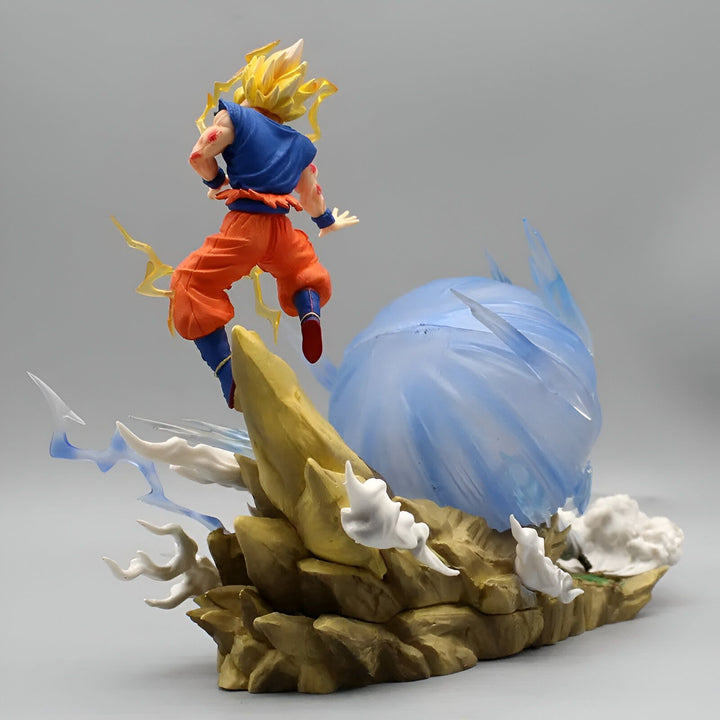 Une figurine de Son Goku, un personnage de Dragon Ball Z, en train de charger un Kamehameha. Il est vêtu de son costume orange et bleu et a les cheveux jaunes. Il est sur un rocher et est entouré d'énergie bleue.,FI-5223712943