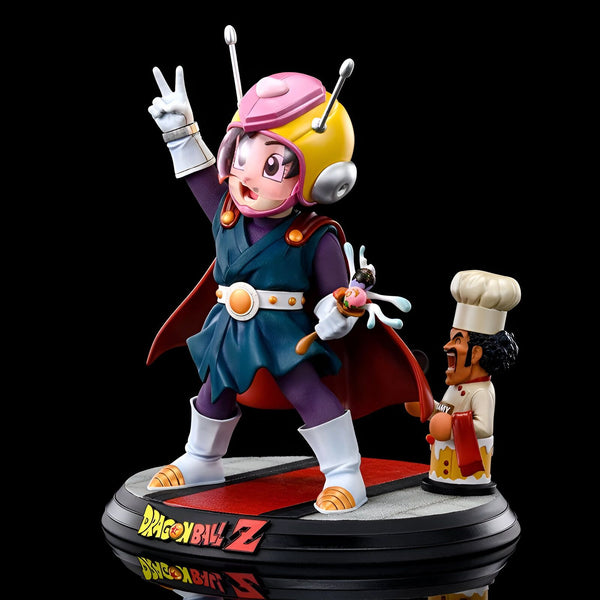 Une figurine en résine de Son Gohan, un personnage de Dragon Ball Z. Il est représenté avec son costume de Great Saiyaman, avec son casque et sa cape. Il est en train de faire un signe de la main. A ses pieds se trouve le personnage de Mr. Satan.,FI-8722975209