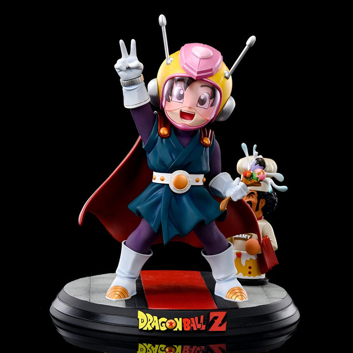 Une figurine de Son Gohan, un personnage de Dragon Ball Z. Il est vêtu d'un costume de super-héros et est en train de faire un signe de la victoire. À ses côtés se trouve un personnage plus petit, qui est en train de cuisiner.,FI-8722975209