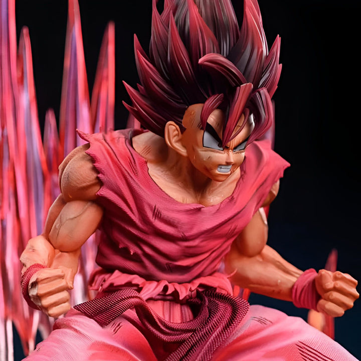 Une figurine de Son Goku, un personnage de Dragon Ball Z, en pleine action. Il est vêtu d'un kimono rouge et a les cheveux hérissés. Il est entouré d'une aura rouge.,FI-3386124755