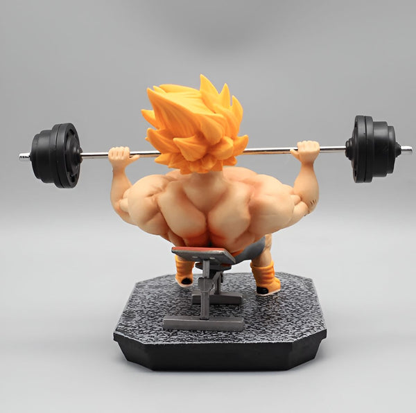Une figurine de Son Goku en train de soulever des poids. Il est torse nu, porte un short orange et des bottes. La figurine est en PVC et mesure environ 15 cm de haut.,FI-8071709026