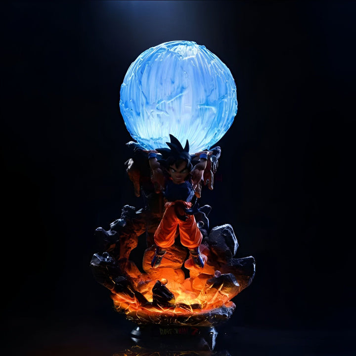 Une figurine de Son Goku, un personnage de Dragon Ball Z, en train de charger un Genkidama. La figurine est éclairée par une lumière bleue et repose sur un socle orange.,FI-6432615402