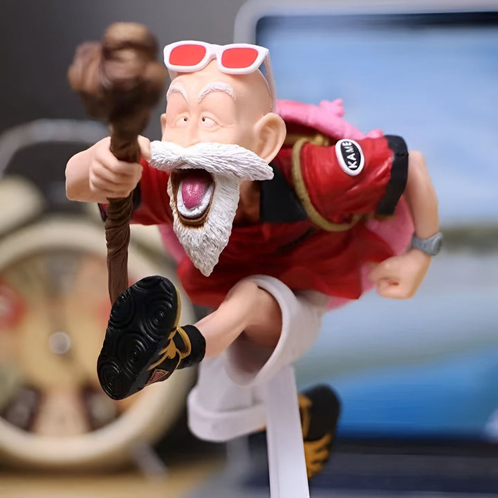 Une figurine de Muten Roshi, un personnage de Dragon Ball, en train de courir. Il porte une chemise rouge, un pantalon blanc et des lunettes de soleil. Il a une barbe blanche et un bâton à la main.,FI-7127817340
