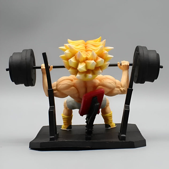 Une figurine de Son Goku en train de soulever des poids. Il est assis sur un banc et porte un short gris et un débardeur rouge. Il a les cheveux jaunes et les yeux bleus. La figurine est en plastique et mesure environ 15 cm de haut.,FI-9270442446