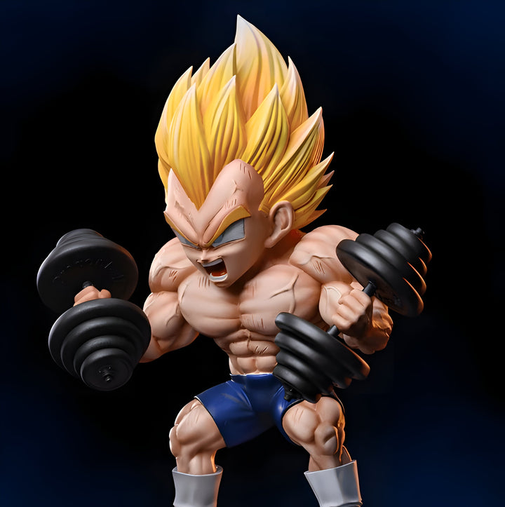 Une figurine de Vegeta, un personnage de Dragon Ball Z, en train de soulever des haltères. Il est représenté avec les cheveux jaunes, les yeux bleus et un corps musclé. Il porte un short bleu et des bottes blanches. La figurine est posée sur un socle noir.,FI-3985104476