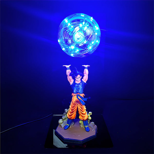 Une figurine de Son Goku en train de charger un Genkidama. La figurine est éclairée par une lumière bleue.,FI-8250584058