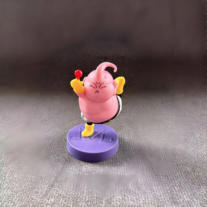 Une figurine de Majin Buu, un personnage de Dragon Ball Z. Il est rose, avec un pantalon blanc et des chaussures jaunes. Il est en train de se mettre en position pour attaquer.,FI-9424726554