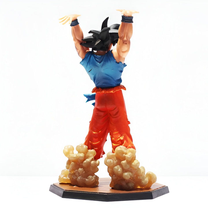 Une figurine de Son Goku, un personnage de la série animée Dragon Ball Z. Il est représenté en train de se téléporter, avec les cheveux dressés vers le haut et les bras tendus. Il porte une combinaison orange et bleue déchirée.,LA-188714949X