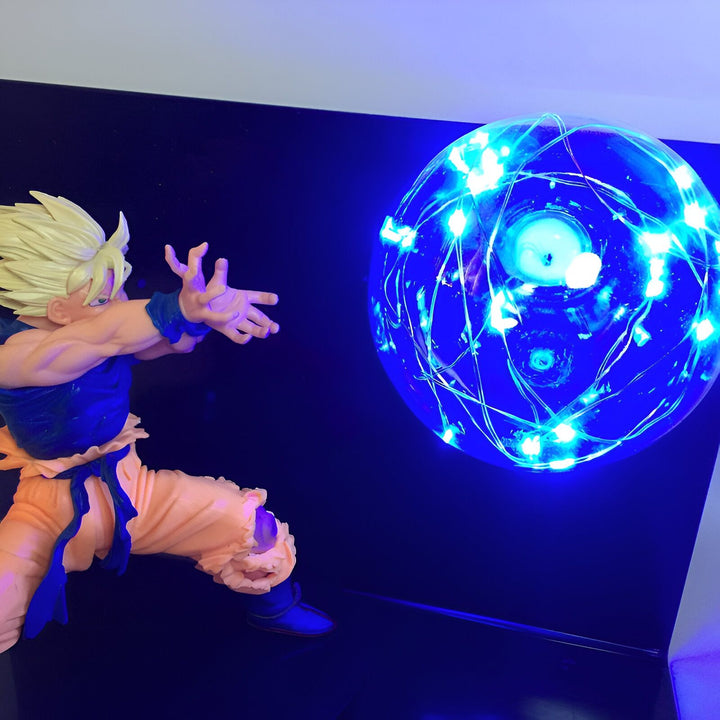 Une figurine de Son Goku en train de lancer un Kamehameha. Le fond est noir et la figurine est éclairée par une lumière bleue.,LA-6245030056