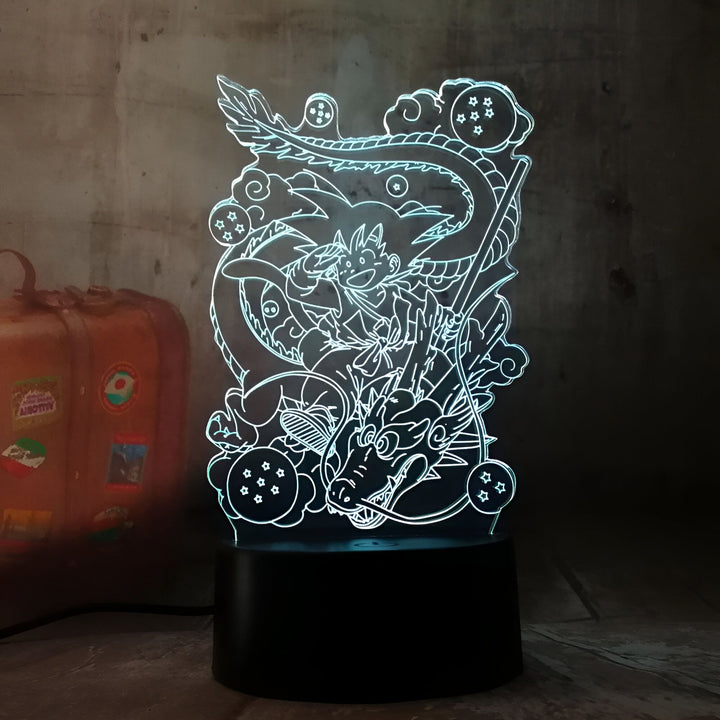 Une image de Son Goku, un personnage de la série animée Dragon Ball Z, chevauchant un dragon Shenron. Il y a des boules de cristal autour d'eux.,LA-9210201272
