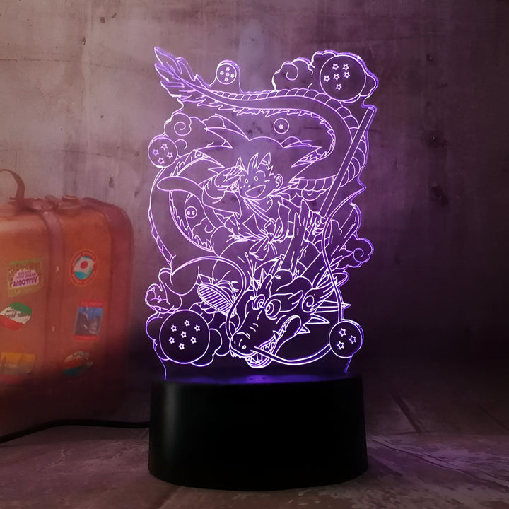Une image de Son Goku chevauchant Shenron, un dragon violet. Il y a des boules de cristal autour d'eux.,LA-9210201272