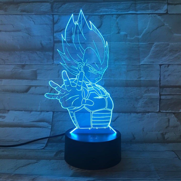 Une image d'une figurine de Vegeta, un personnage de la série Dragon Ball Z. La figurine est éclairée par une lumière bleue et est posée sur un socle noir.,LA-9800412301