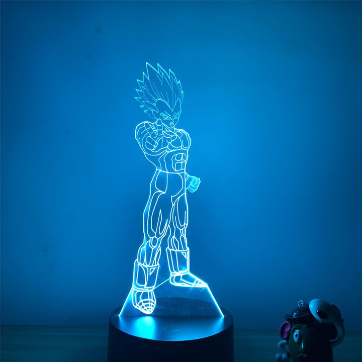 Une image d'un personnage de dessin animé, Vegeta, de la série Dragon Ball Z. Il est représenté debout, avec les cheveux dressés et les poings serrés. La lumière bleue qui l'entoure le fait ressortir de l'arrière-plan sombre.,LA-7786528288